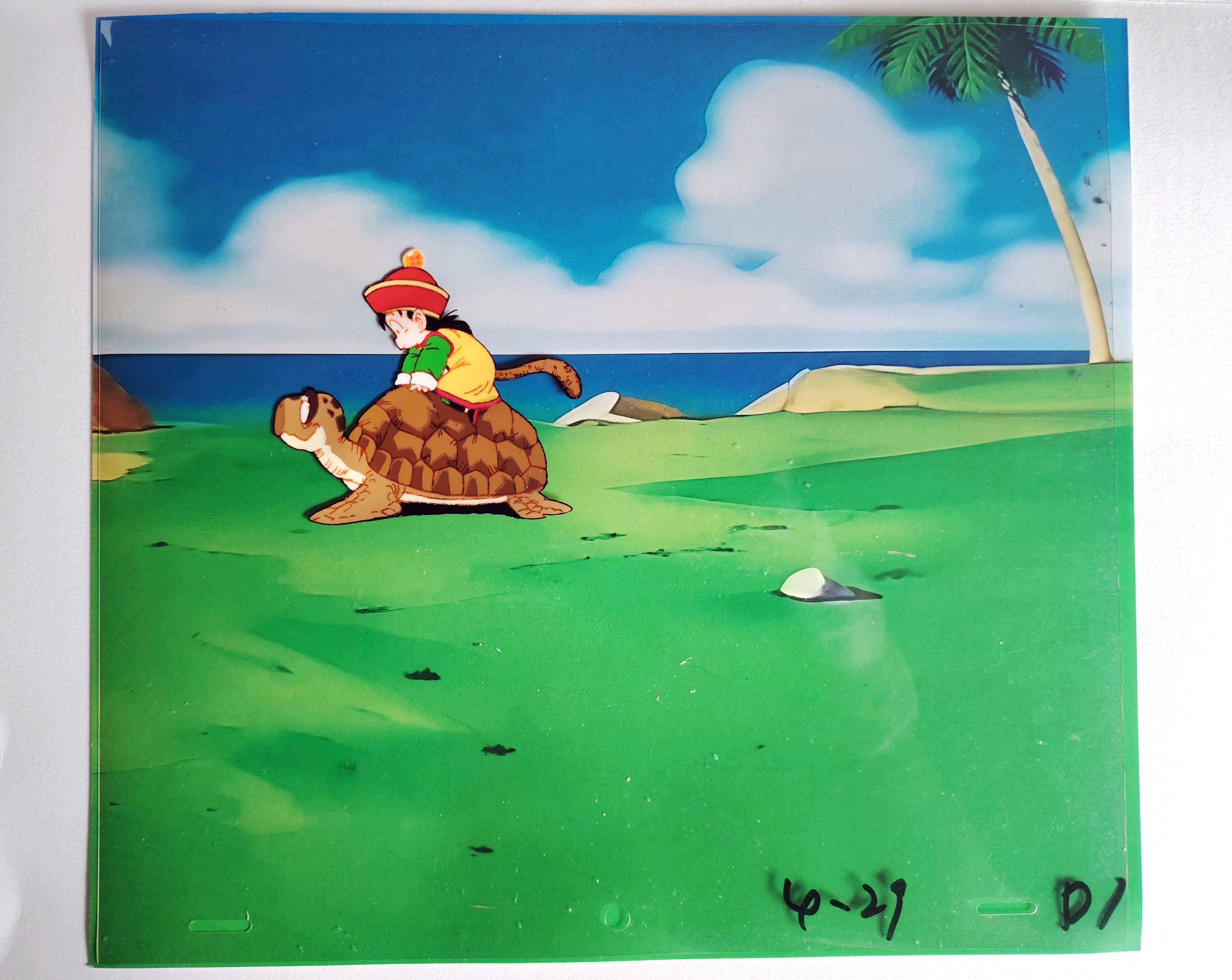 Original Dragon Ball Z cel with printed background of Gohan and Umigame from episode 2 (1989)